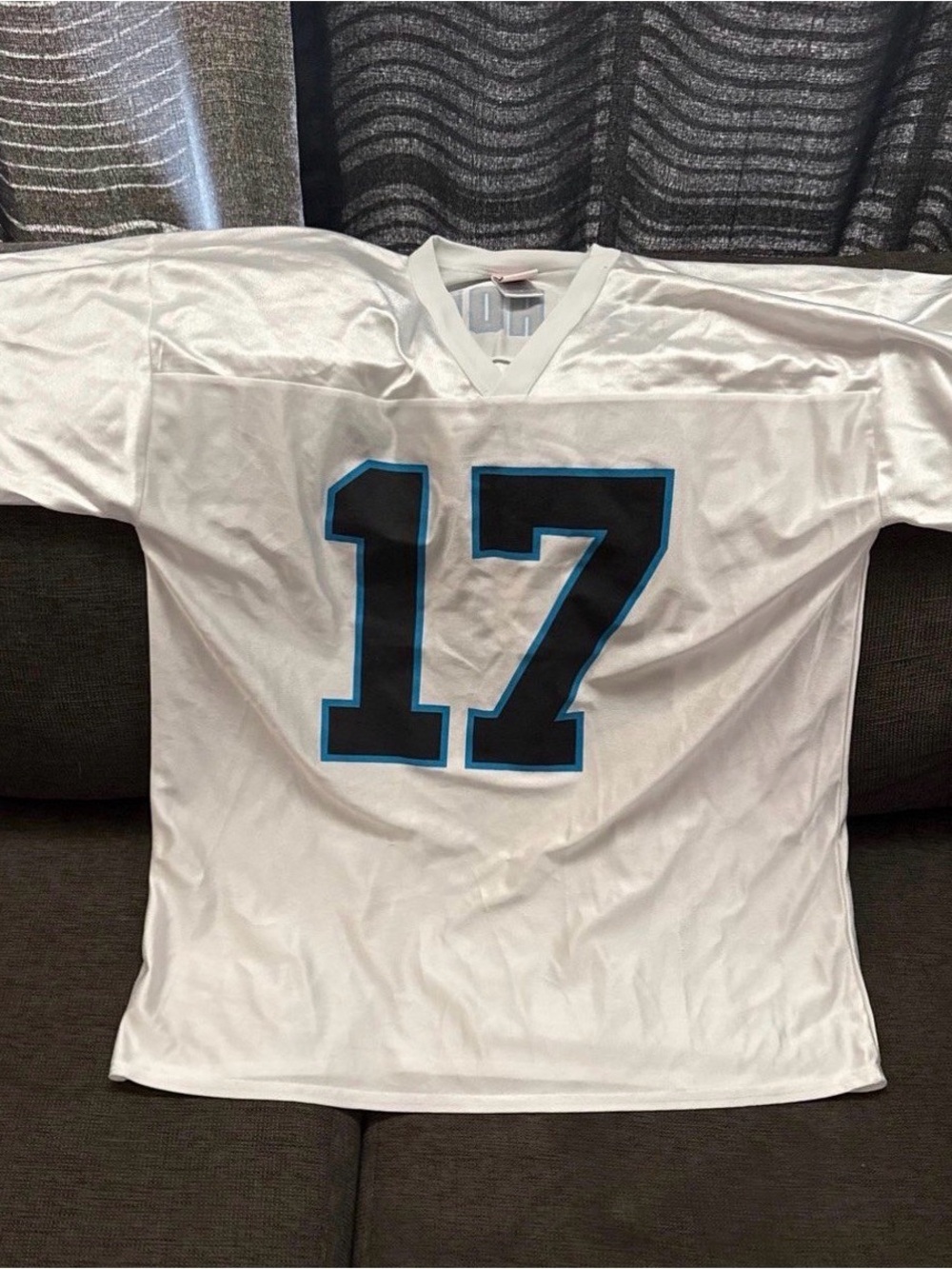 NFL White Football Jersey with Black and Light Blue Accents - Picture 3 of 3